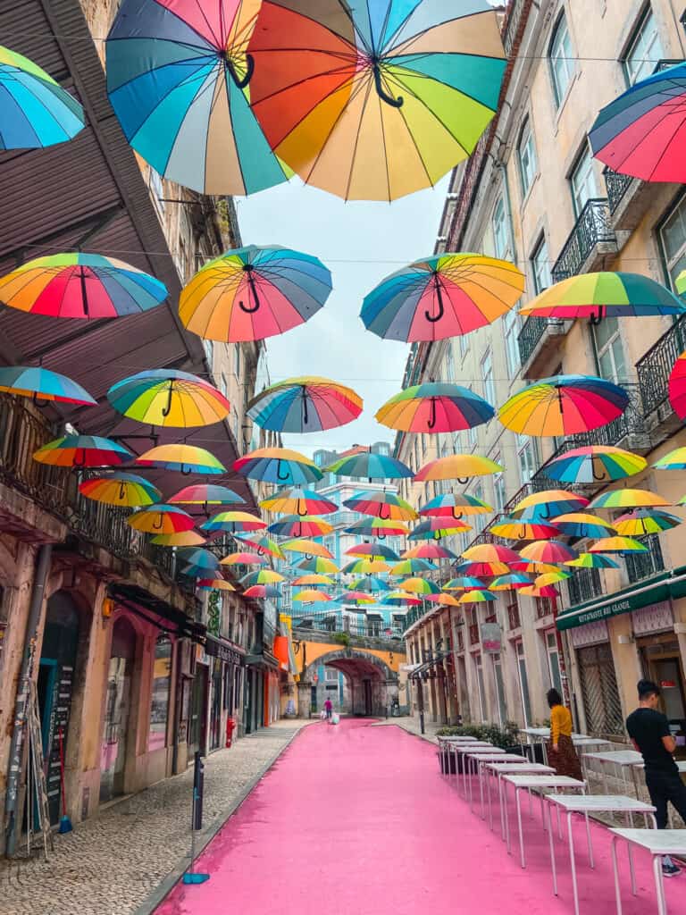 Pink Street In Lisbon With Umbrellas